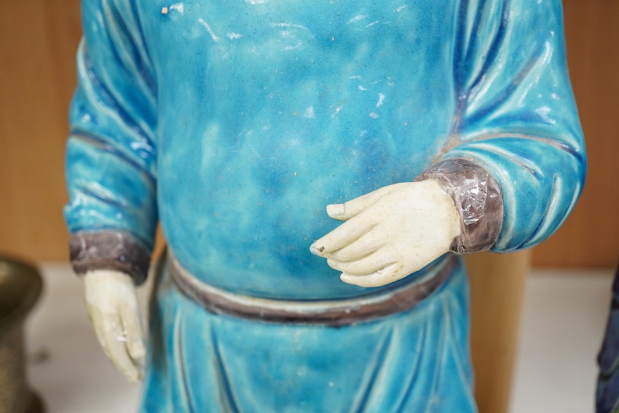 Two Chinese pottery glazed figures to include a Shiwan mudman, largest 48cm high